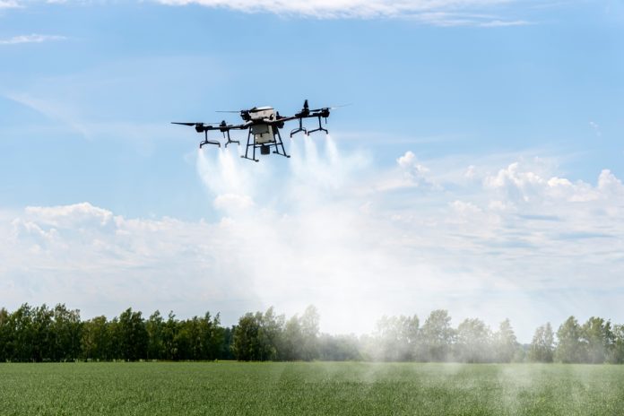 Modern,Technologies,In,Agriculture.,Industrial,Drone,Flies,Over,A,Green