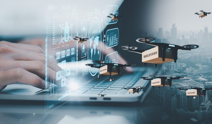Businessman,Using,Laptop,Computer,control,Drone,Delivery,To,Customers,business,Concept,Autonomous