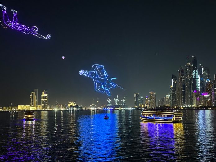 Drone,Show,On,Dubai,Beach,With,Palm,Jumeirah,View